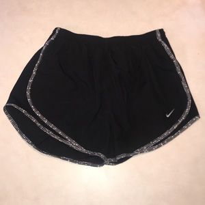 M black Nike shorts with white design on trim